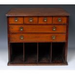 A 19th century mahogany table top office filing chest, oversailing top above four small drawers,