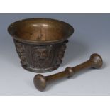 A 17th century dark patinated bronze pestle and mortar,