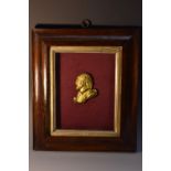 A 19th century gilt metal profile portrait plaque, 6.