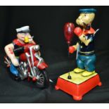 Two reproduction cast metal Popeye figures motorcycling and boxing