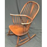 An Ercol style spindle back rocking chair.