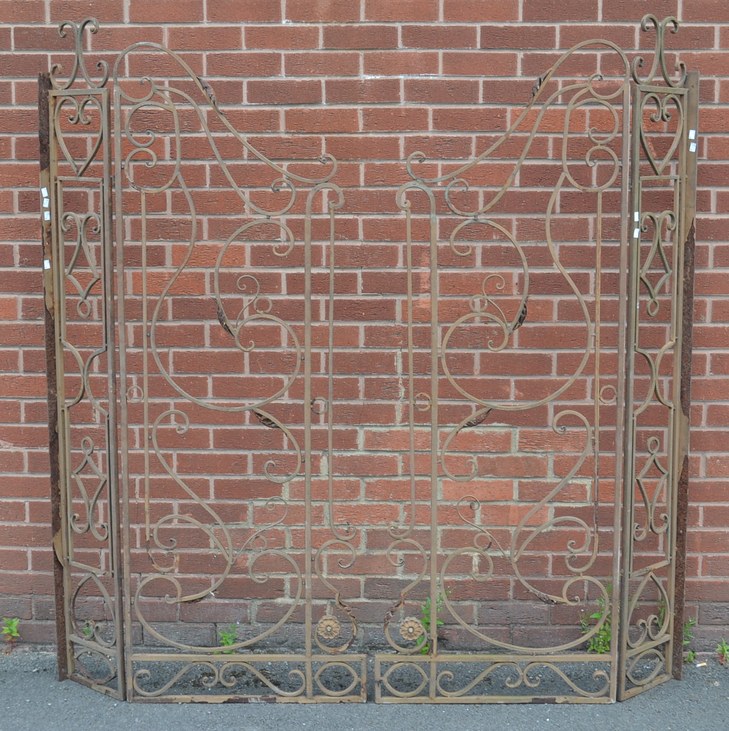 A pair of 20th century decorative hinged gates