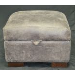 A designer leather pouffe/ottoman