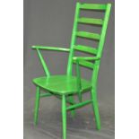 A green Ercol ladder back chair