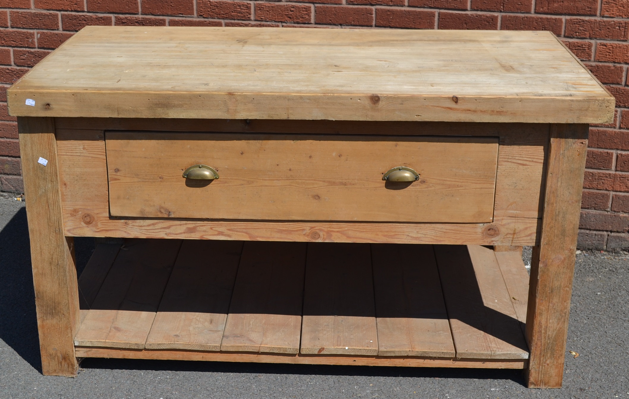 A large butcher's block, large top, pine base, deep drawer to frieze, plank undertier.