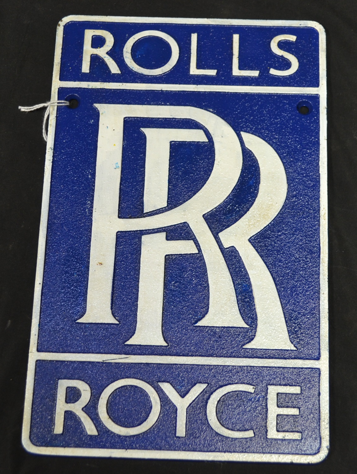 A cast metal reproduction Rolls Royce wall plaque