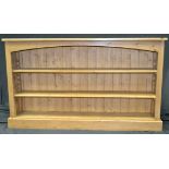 A pine low bookcase, adjustable shelving,