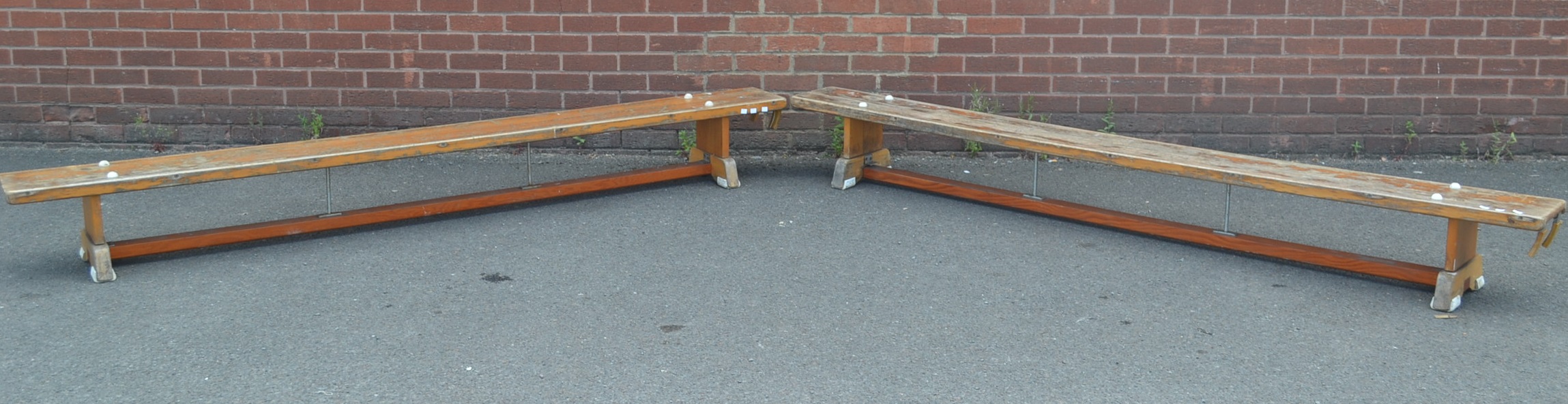 A pair of Niels Larsen gym benches 263cm long