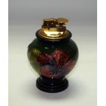 A Moorcroft hibiscus pattern table lighter, 11.