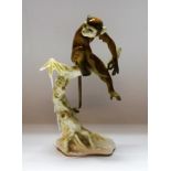 A Heutschenreuther monkey model, seated on a branch,