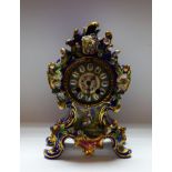 A late 19th century French Rococo mantel clock, with Roman numerals, on a bleu celeste ground,