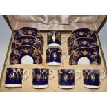 A set of six Royal Crown Derby demi tasse coffee cans and saucer,