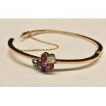 A diamond, ruby and sapphire hinge bangle, raised floral cluster of an old rose cut diamond,