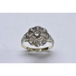 A diamond cluster ring, central round cut diamond approx 0.