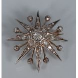 A diamond star pendant brooch, encrusted with forty one diamonds,