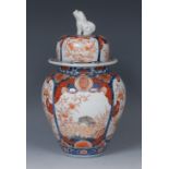 A Japanese Imari ovoid vase and cover, decorated with fanciful birds, rabbits and scrolls,