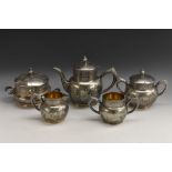An American Aesthetic Movement electro-plated five piece tea service, comprising teapot, milk jug,