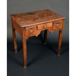 A mid 18th century oak lowboy, rectangular moulded top above three frieze drawers,