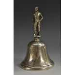 A 19th century silver coloured metal table bell, figural handle,