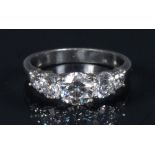 A diamond quintet ring, central round brilliant cut diamond 0.