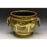 A large Japanese jardiniere, the sides with six shaped panels embossed with storks, phoenix,