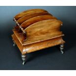 A George/William IV rosewood and mahogany canterbury, arched divisions with turned handles to sides,