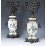 A pair of Chinese bronze and porcelain three light candleabra,