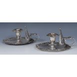 A pair of George IV old Sheffield plate shaped circular chambersticks, campana sconces,