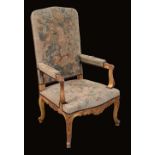 A Louis XV style giltwood armchair, stuffed over tapestry upholstery,