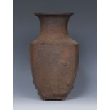 A Japanese iron panelled baluster vase, cast in high relief with scattered seashells,