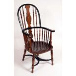 A 19th Century American beech and ebonised Windsor elbow chair,