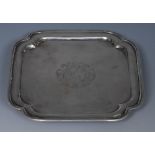 A George I silver incurved square card waiter, crested field, bracket feet, 14.