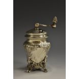 A 19th century French Rococo Revival silver spirally fluted bombe shaped pepper grinder,