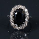 A diamond and sapphire oval cluster ring,