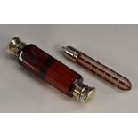 A 19th century silver coloured metal mounted ruby glass double-ended scent bottle,