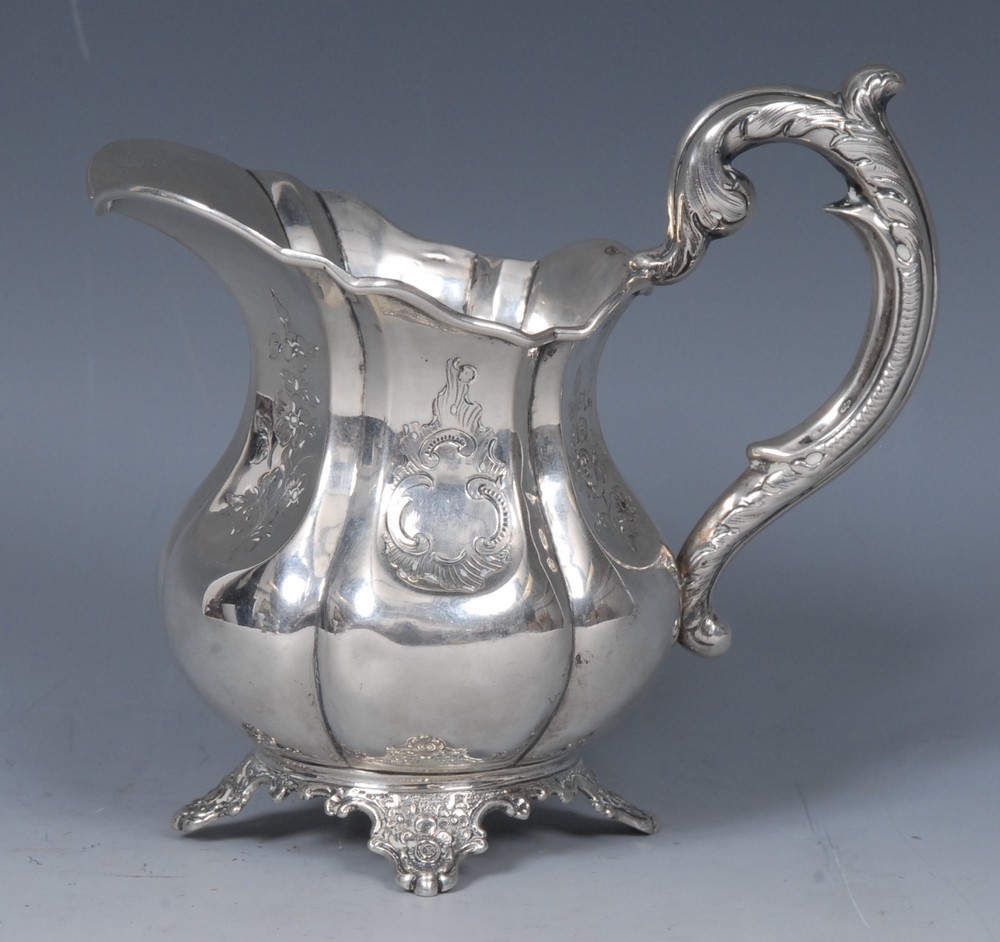 A 19th century Dutch silver melon shaped cream jug, acanthus scroll handle, cartouche shaped feet,