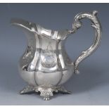 A 19th century Dutch silver melon shaped cream jug, acanthus scroll handle, cartouche shaped feet,