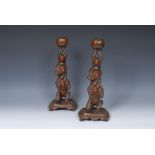 A pair of Japanese bronze novelty candlesticks, as three monkeys as the column, See No Evil,