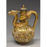 An unusual Japanese Satsuma earthenware ewer, boldly modelled with a ferocious dragon in pursuit,