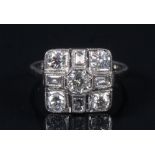 A diamond cross panel ring, central round cut diamond,