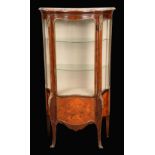 A Louis XV revival gilt metal mounted kingwood and marquetry shaped serpentine vitrine,