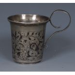 A 19th century Russian silver and niello vodka cup, engraved with scrolling leafy stems, flared rim,