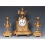 A 19th century French gilt metal clock garniture, 9.