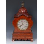 A late 19th century mantel clock, the 14cm silvered dial with Roman numerals, twin winding holes,