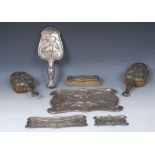 A comprehensive Art Nouveau silver dressing table set, comprising a tray, graduated trinket dishes,