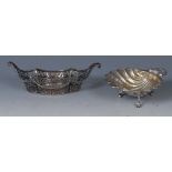 A George II style silver-gilt shell shaped dish, chased with stiff leaves and C-scrolls, knurl feet,