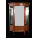 A large Edwardian mahogany shaped serpentine display cabinet,