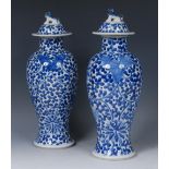 A pair of Chinese baluster vases and covers,