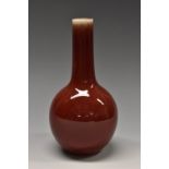 A Chinese sang de boeuf monochrome ovoid bottle vase, 19.