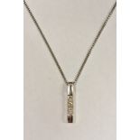 A contemporary diamond trilogy pendant, linear set with three princess cut square diamonds,